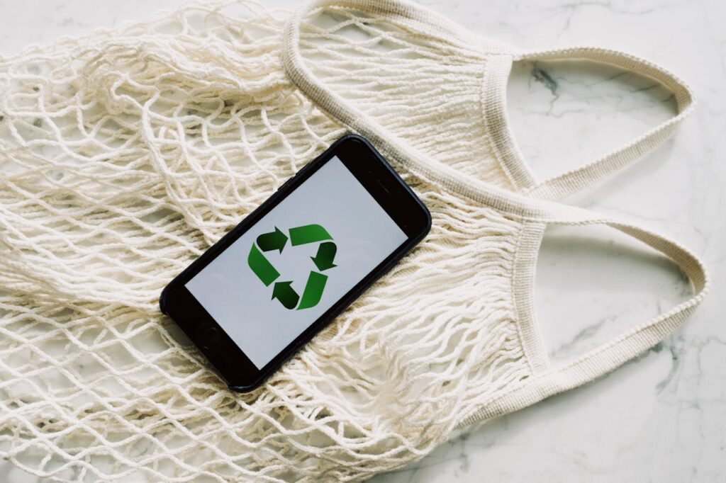 Feature image with a title "How Will Circular Fashion Create New Business Opportunities" and "recycle" sign