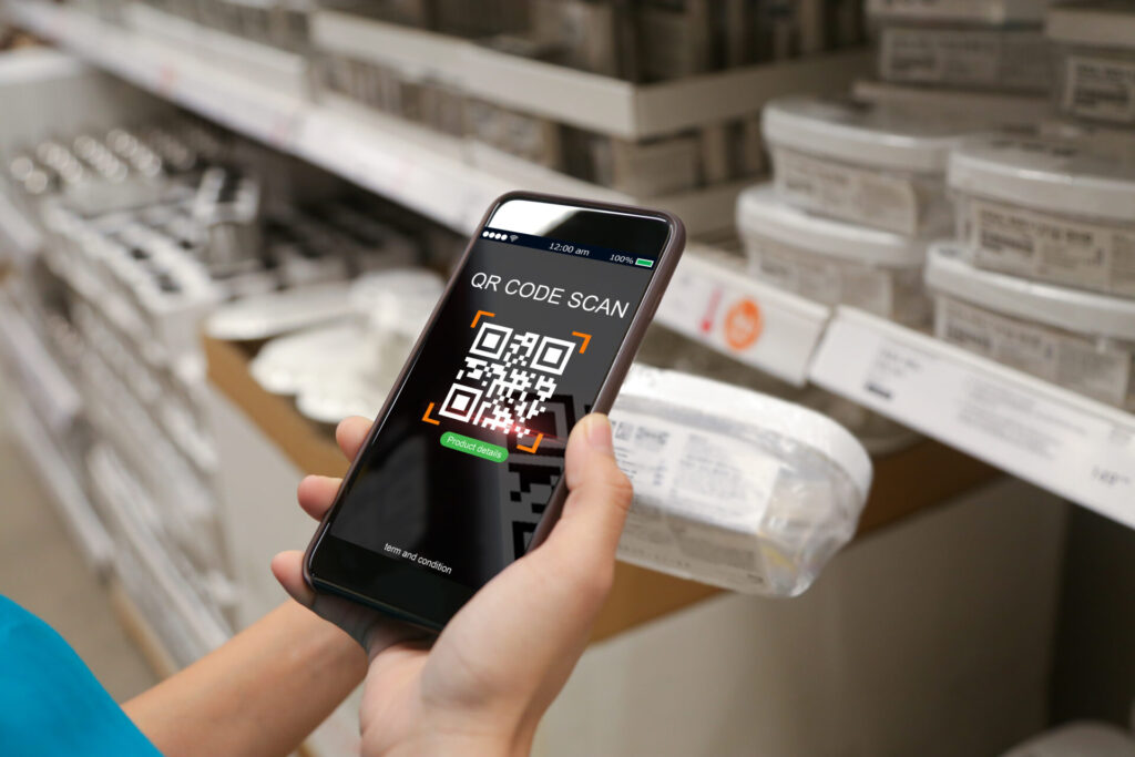 A person scanning a product qr in the store